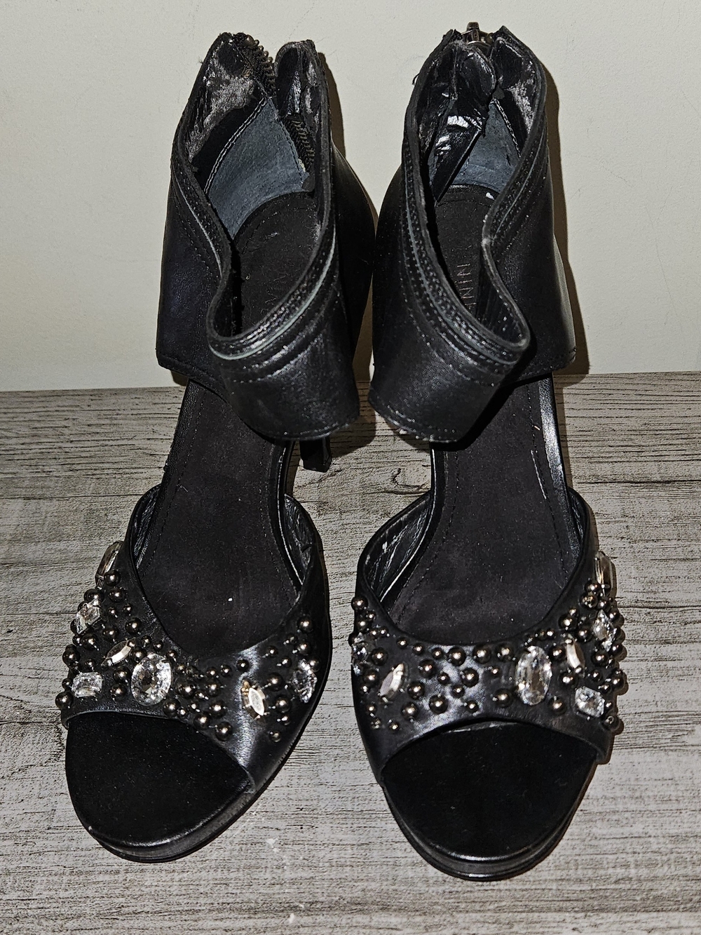 Nine West heels feature black leather uppers adorned w silver-tone studs